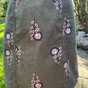 Boden olive green mini skirt with pockets.  Pink flower design.
